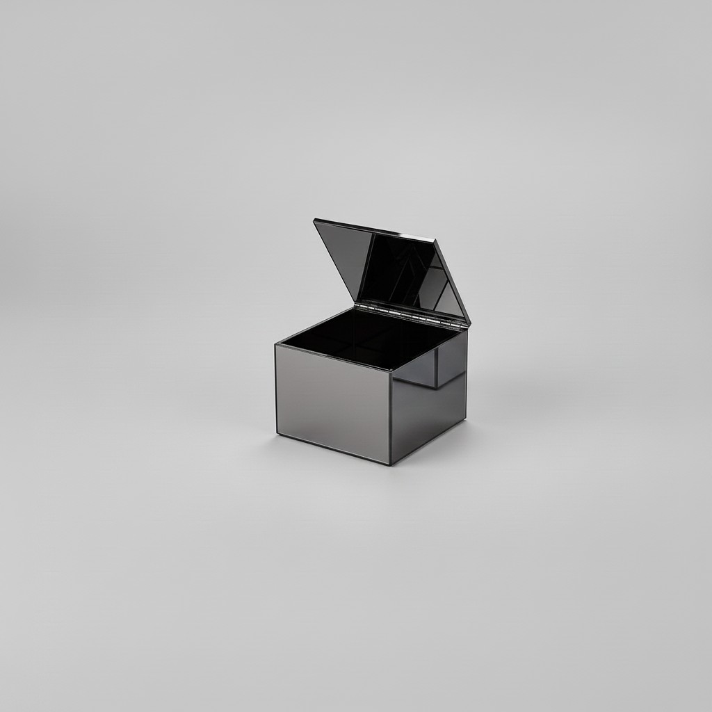 Darkened chrome mirror cube with hinged lid open